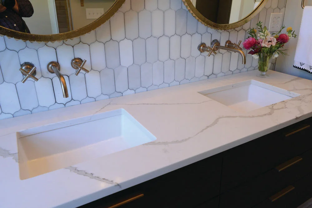 Click Countertops client bathroom with Regal Statuary quartz.