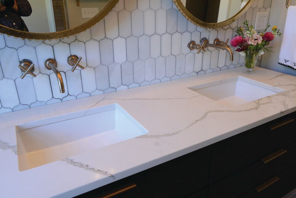 Click Countertops client bathroom with Regal Statuary quartz.